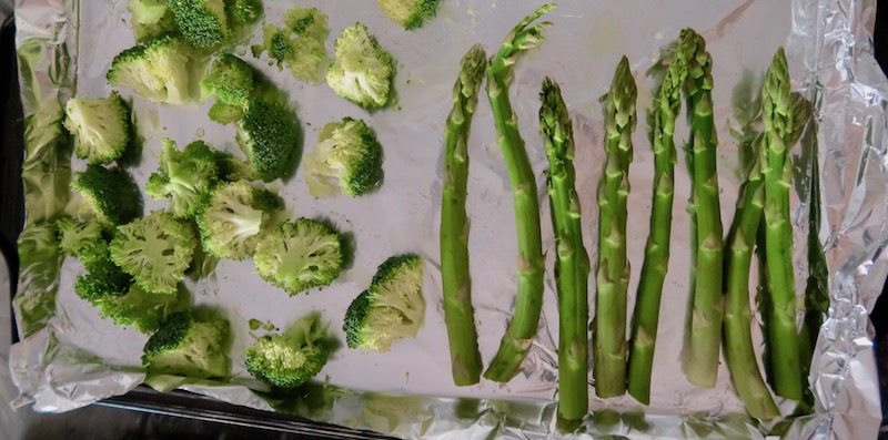 meal prep roasted vegetables broccoli and asparagus on a tray