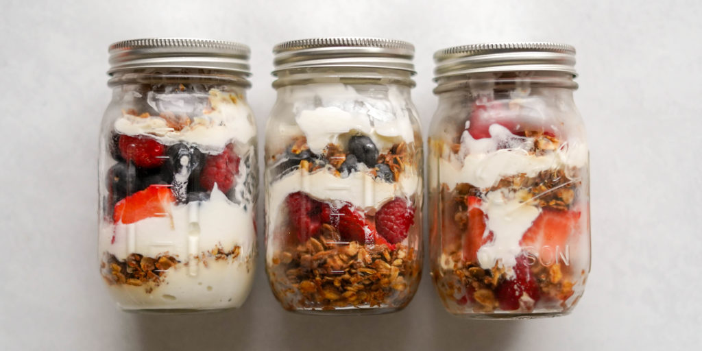 mason jars with homemade granola for parfait recipe