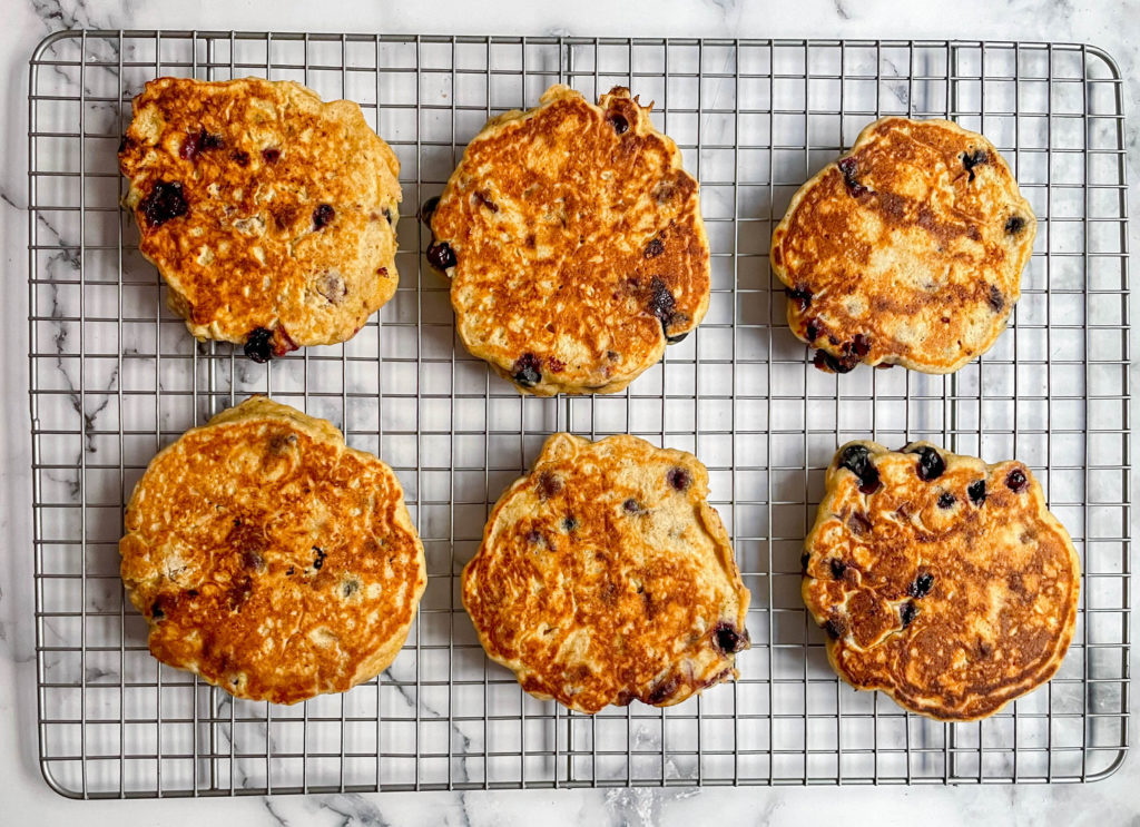 Blueberry Lemon Pancakes on a wire cooling rack