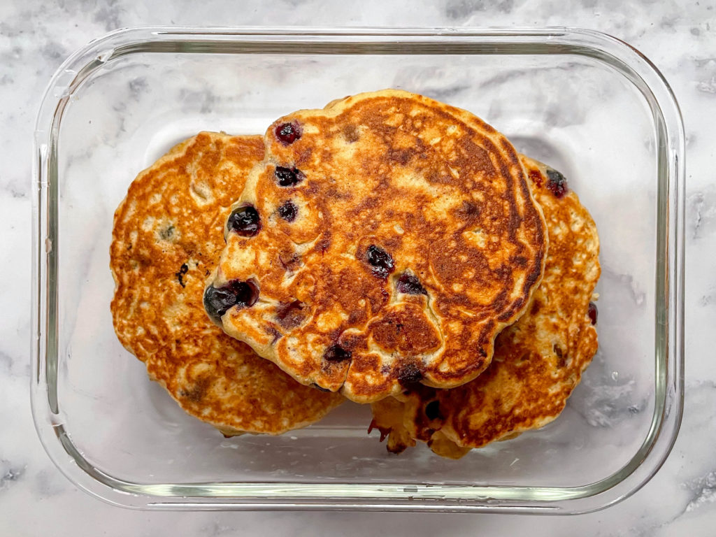 Blueberry Lemon Pancakes in a glass meal prep container.