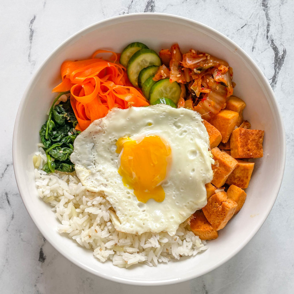 bibimbap bowl with a sunny side up egg on top- meal prep friendly recipes