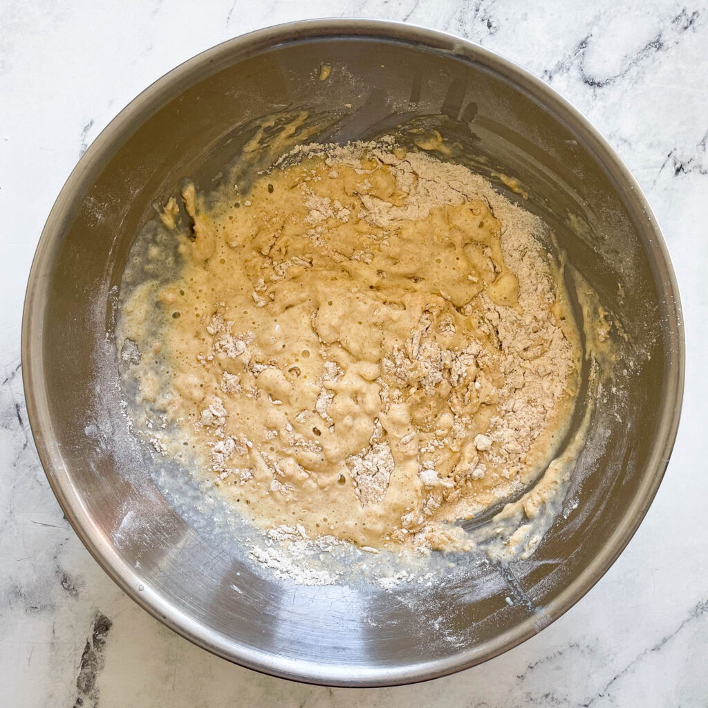 a bowl full of pancake batter that's not fully mixed yet