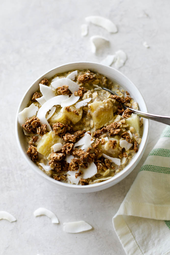 pineapple coconut overnight oats with granola topping