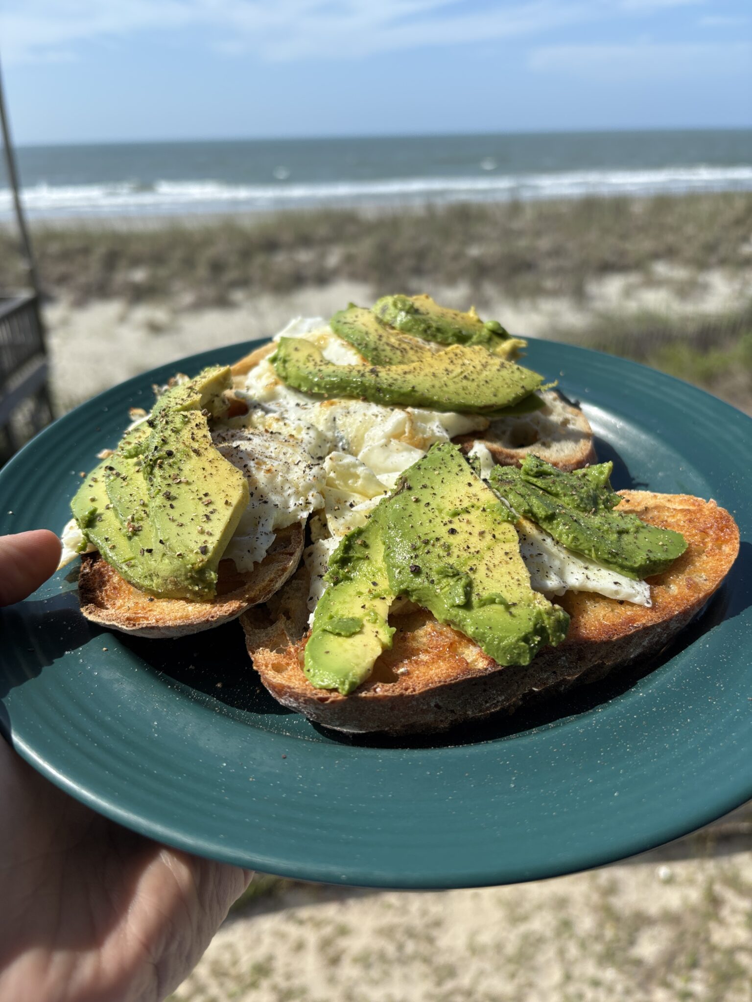 beach breakfast avocado toast with egg